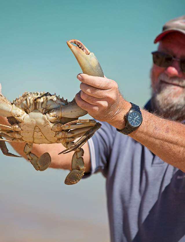 Man holding a mud crab caught at Pardoo Station in the Pilbara