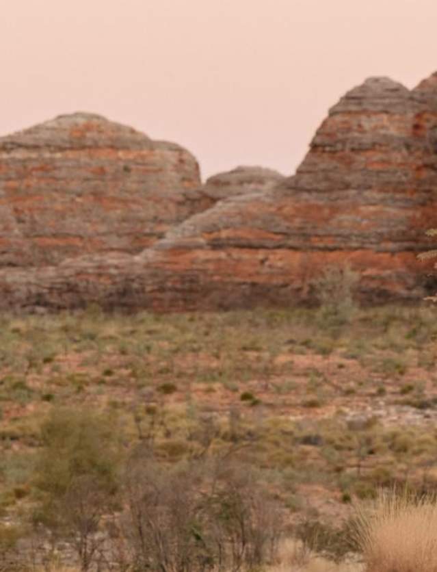 Two men walking at the domes in Purnululu National Park Tourism Western Australia
