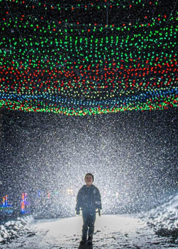Kid under a tunnel of lights