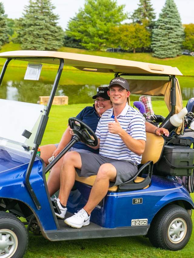 Golfers in a golf cart