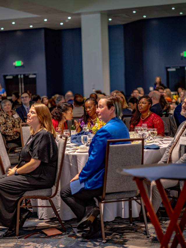 conference ballroom with people at round tables