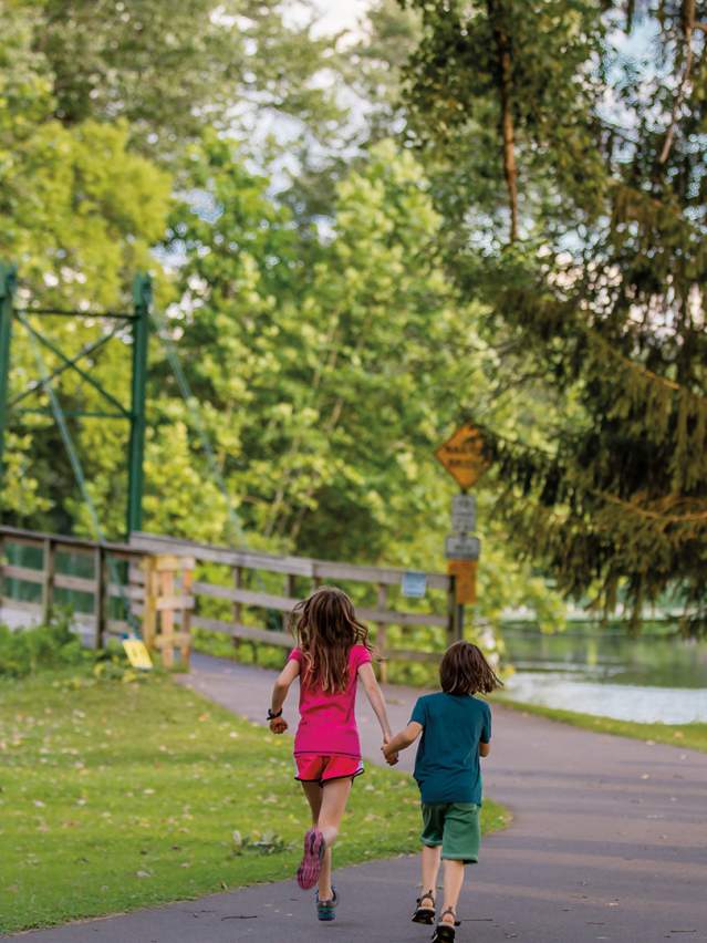 kids running on paved waterfront trail