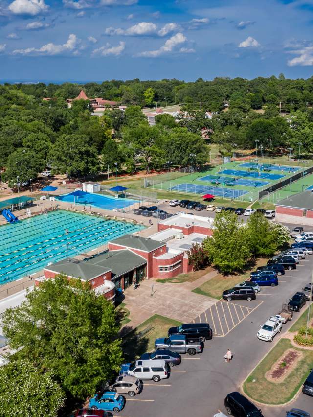 Creekmore Park boasts a tennis center and pool for sports use.