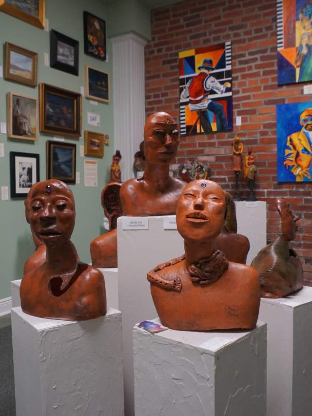 Terra cotta statues and colorful paintings bring tourists to Hidden Talent, and art gallery in Fort Smith.