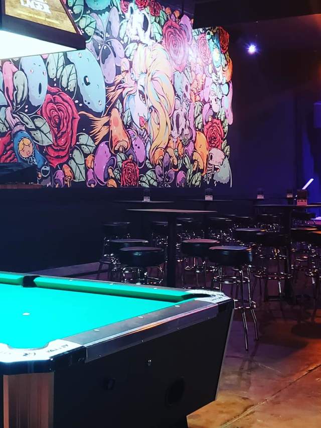 A well-lit pool table in a bar in Fort Smith, Arkansas.