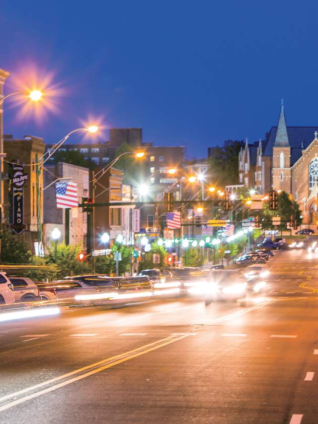 A view of Garrison Avenue in Fort Smith lit up at night.