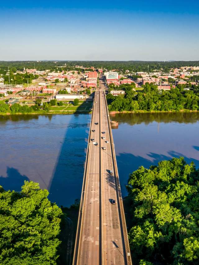 A four-lane bridge expands across the Arkansas River from Oklahoma to Fort Smith, Arkansas.