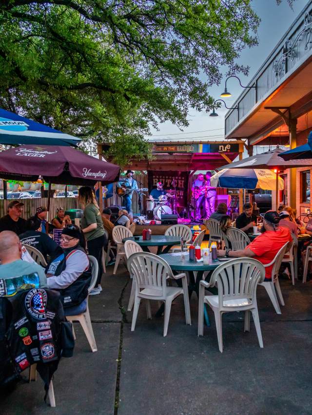 People enjoy live music and BBQ on the Rib Room outdoor patio off Garrison Avenue in Fort Smith.