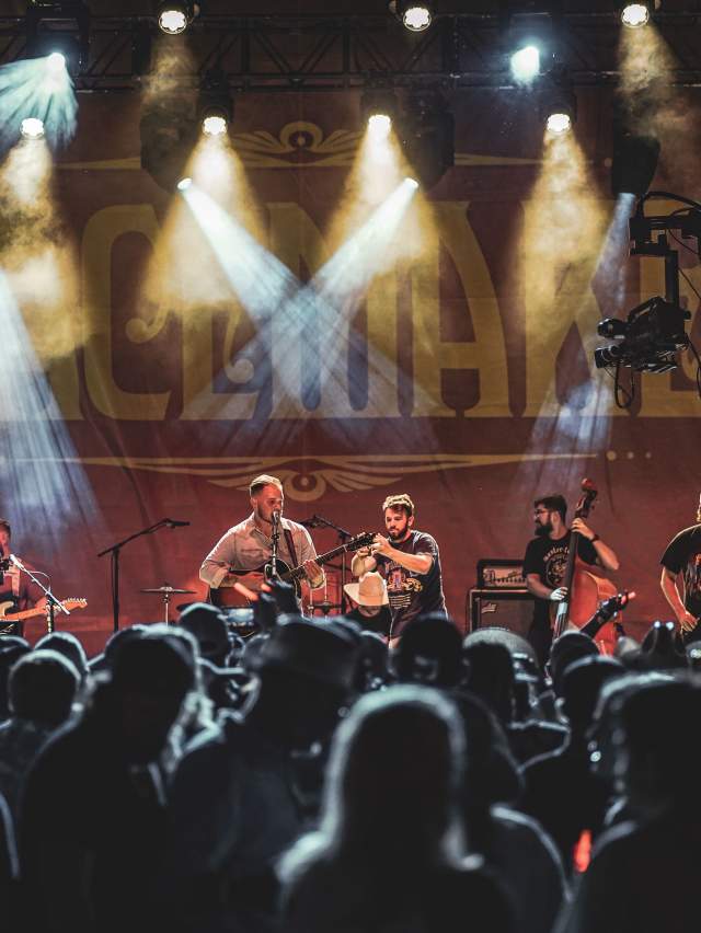 Zach Bryan and his band play on the Peacemaker Festival main stage.