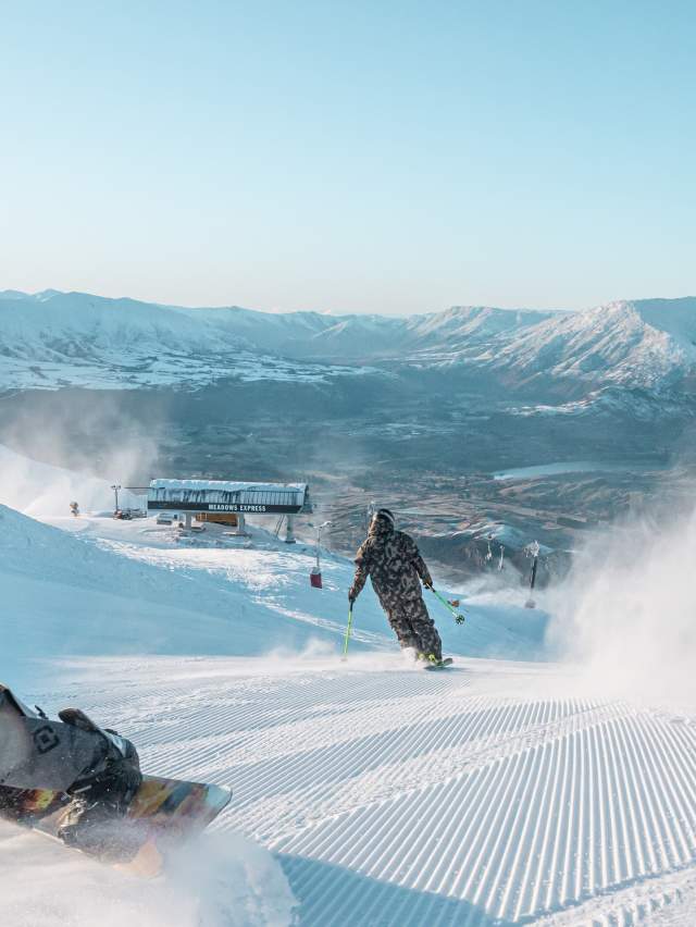 Skiers shredding Coronet Peak mountain