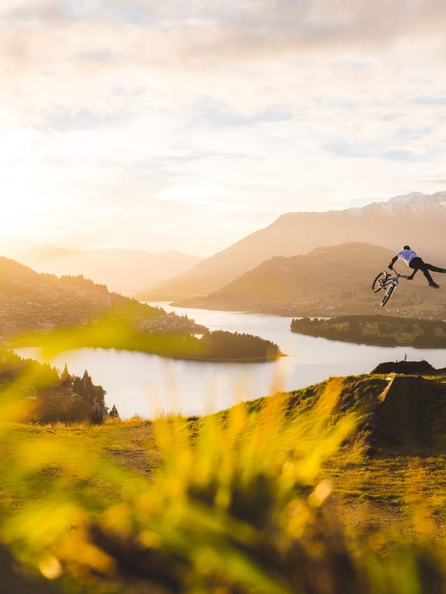 Mountain Biker Jumping in Queenstown New-Zealand