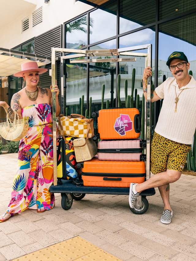 Two people sitting on luggage rack at the Thompson Hotel in Palm Springs