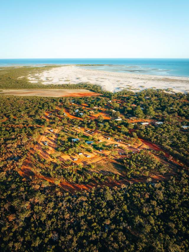 Aerial photo of the campground at Lombadina Community, showing the campground with the beach and ocean beyond.