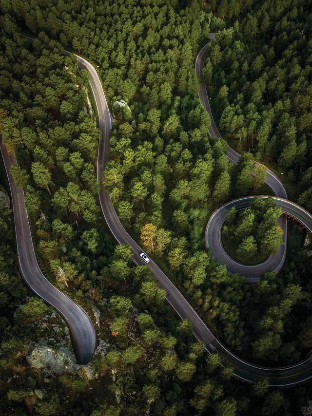 Aerial view of a car driving on Iron Mountain Road