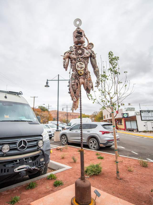 Flying iron person sculpture