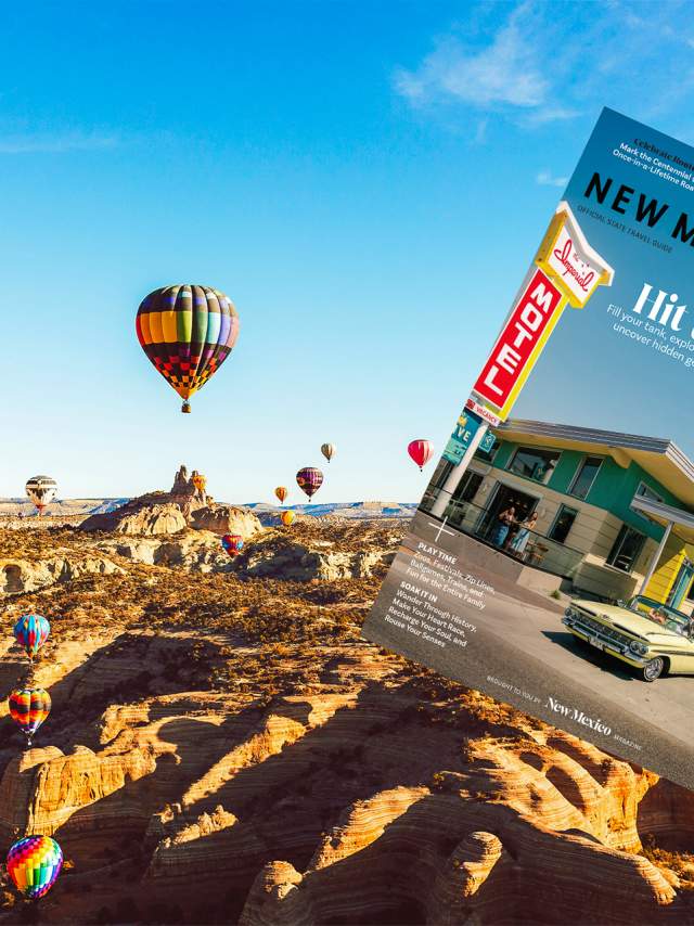 This image features a New Mexico landscape with numerous colorful hot air balloons floating over a rocky desert terrain. In the foreground, there is a magazine cover titled "New Mexico True," showcasing a vintage car parked in front of a classic diner with the headline "Hit the Road".