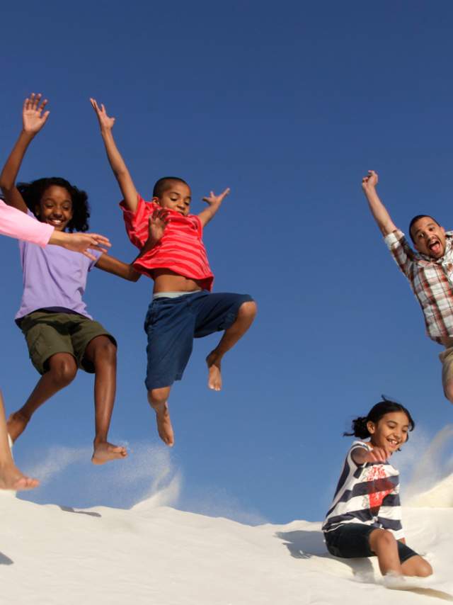 A family has some fun at White Sands National Monument.