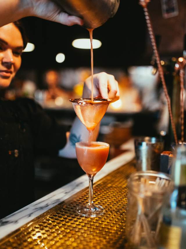 The Courtesy Bar interior bartender