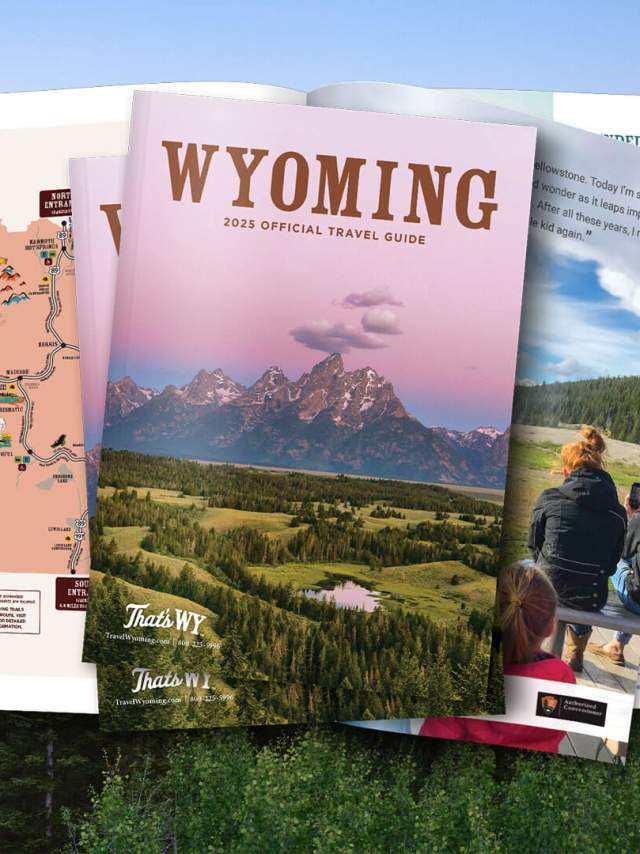 an open printed guide showing Wyoming landscapes