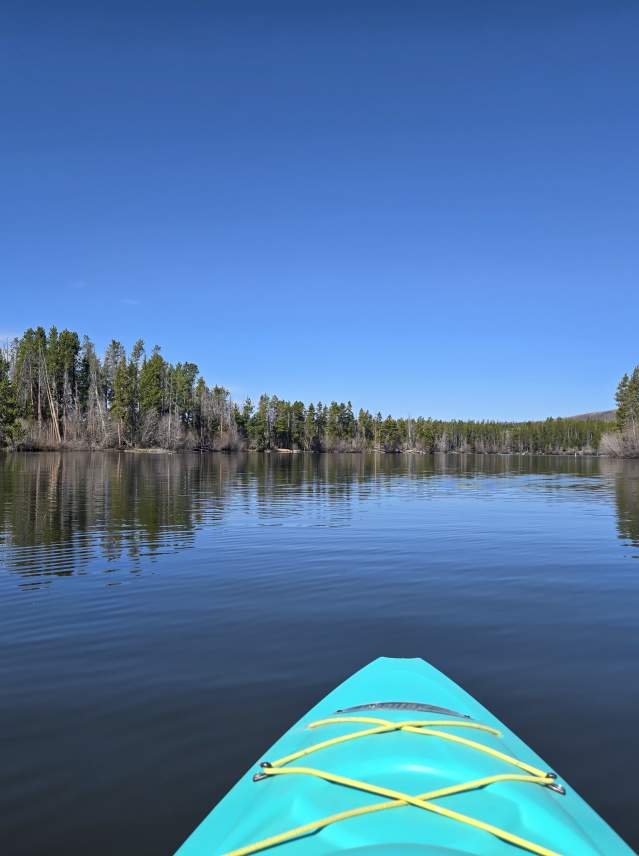 Kayak on the still water of Shadow Mountain Reservoir's islands