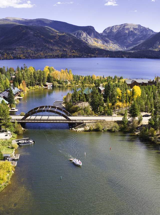 A fall aerial view of Grand Lake, the Channel and rainbow bridge