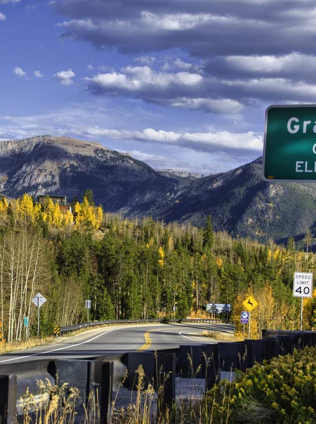 Grand Lake city limit sign in the fall colors with elevation 8369