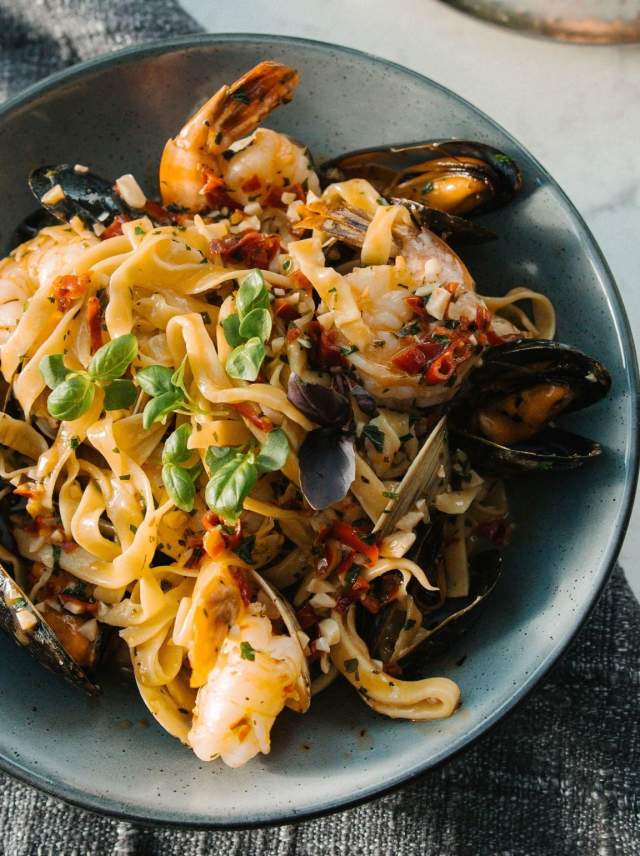 A bowl of seafood and pasta