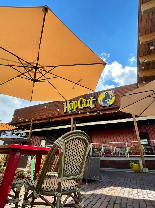 Tables and chairs on the patio at hopcat