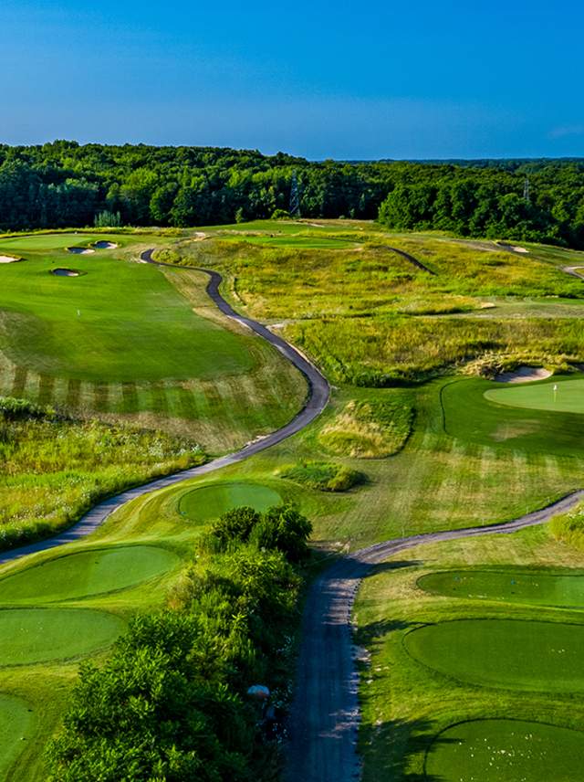 A serene green golf course at Gull Lake View Golf Resort.