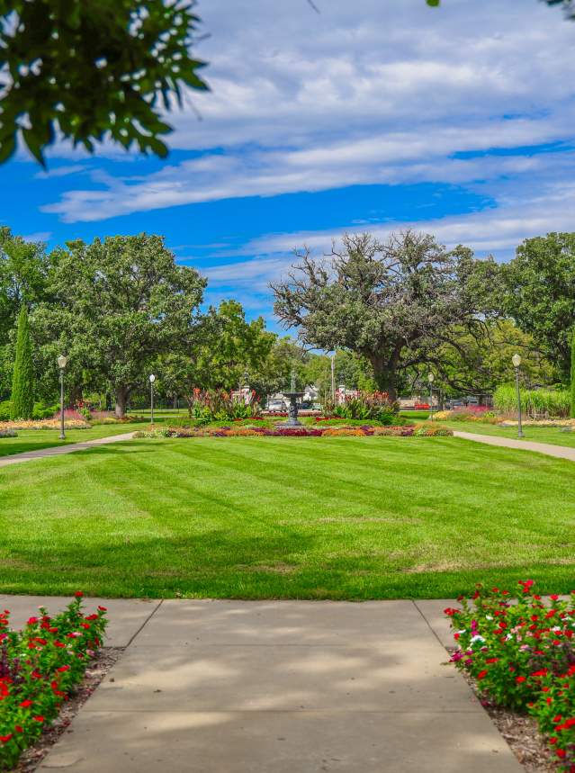 Oakdale Park with trees and a blue sky