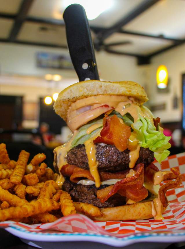 Large, Stacked Burger and Fries