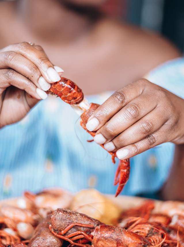 Woman Peeling Crawfish