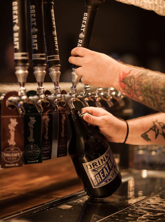 Beertender Pouring Draft Beer at Great Raft Brewing