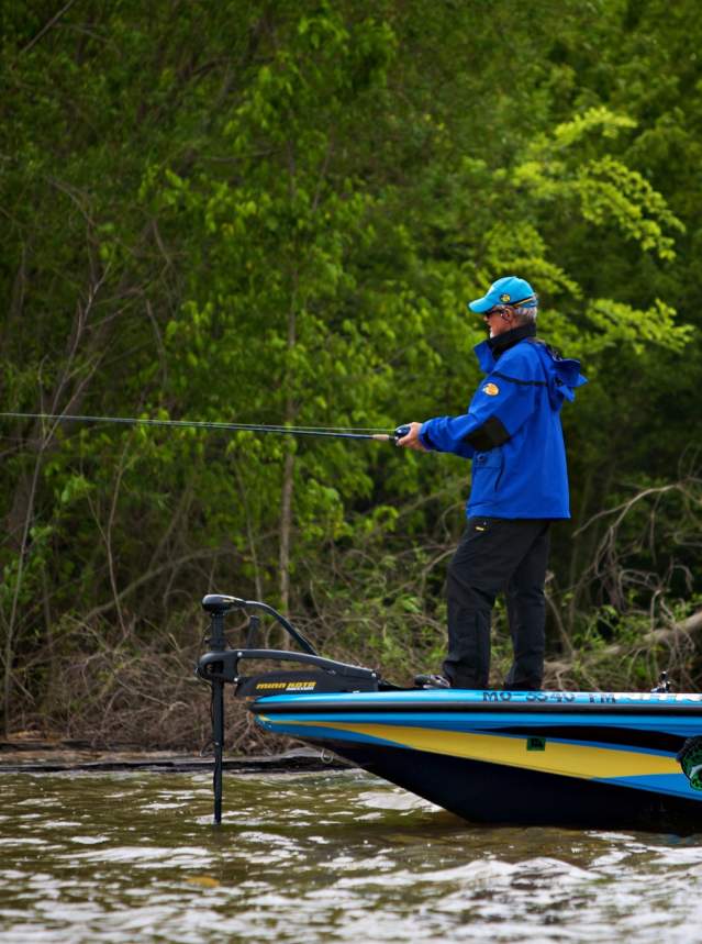 Man Fishing Off of Boat