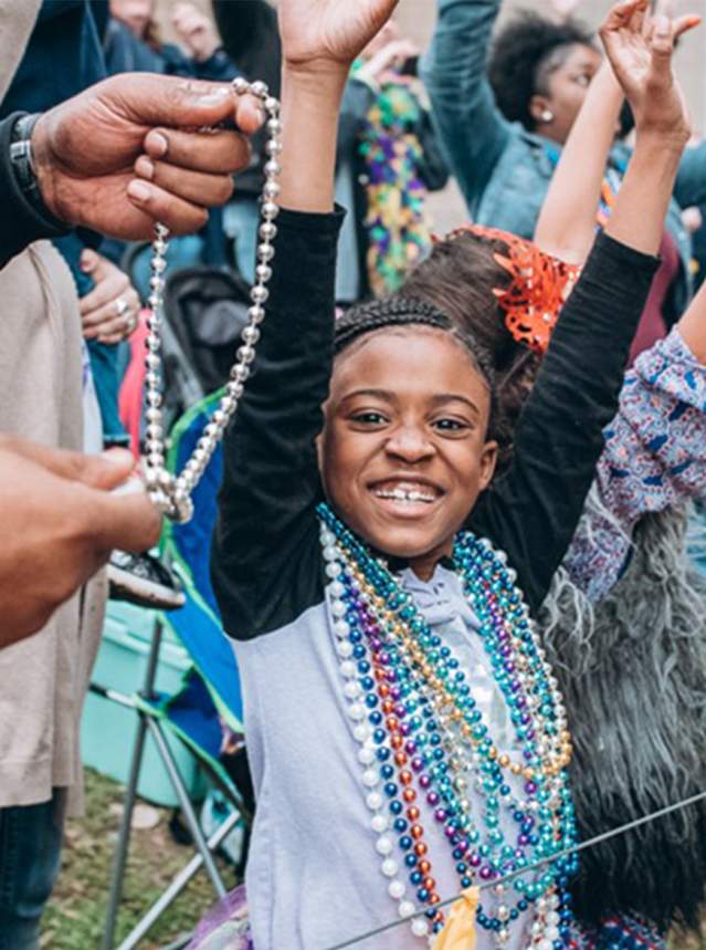 Child Enjoying Mardi Gras Parade