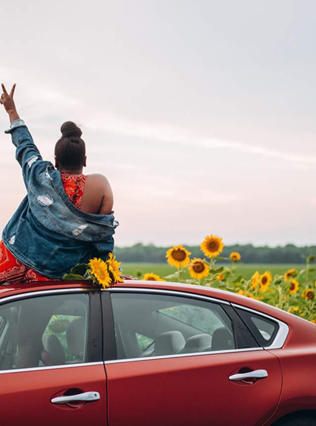 Woman in sunflower field on Boom or Bust Byway in northwest Louisiana