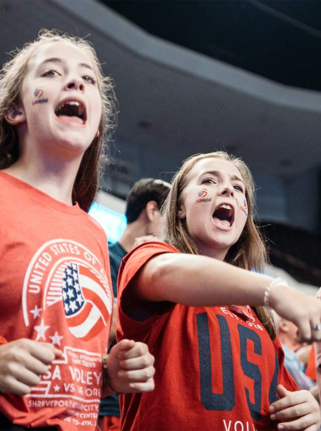 A photo of a crowd at a volleyball game