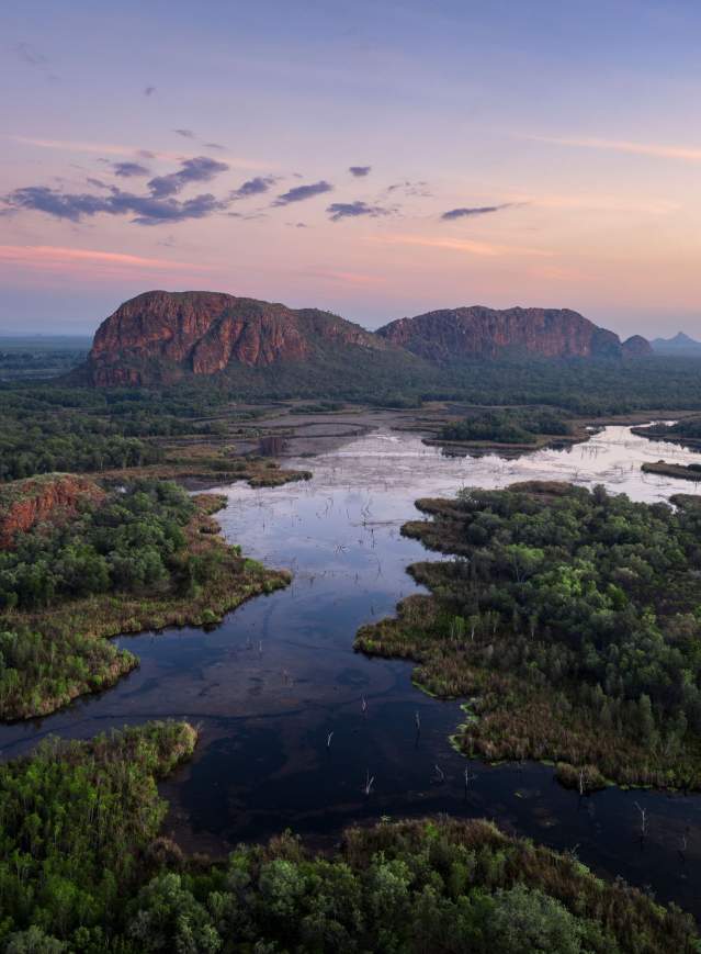 Kununurra waterways with the scenic rock formation known as Sleeping Buddha in the background. The photo is taken in the changing morning light.