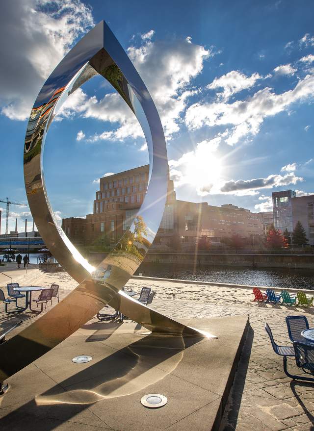 Sculpture at Rotary Park with the Grand River in the background.