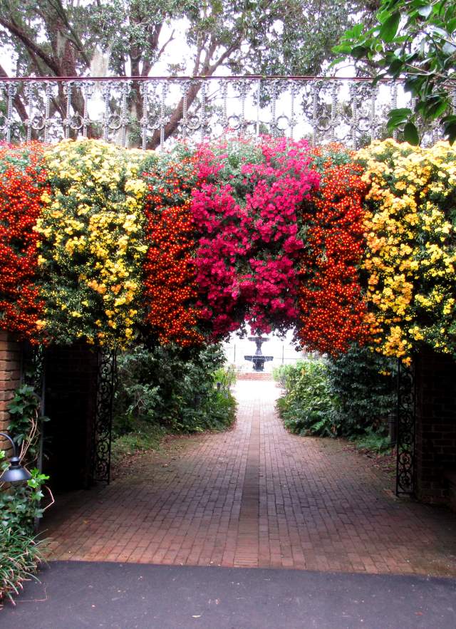 Mums hanging over the side of a bridge over a walkway