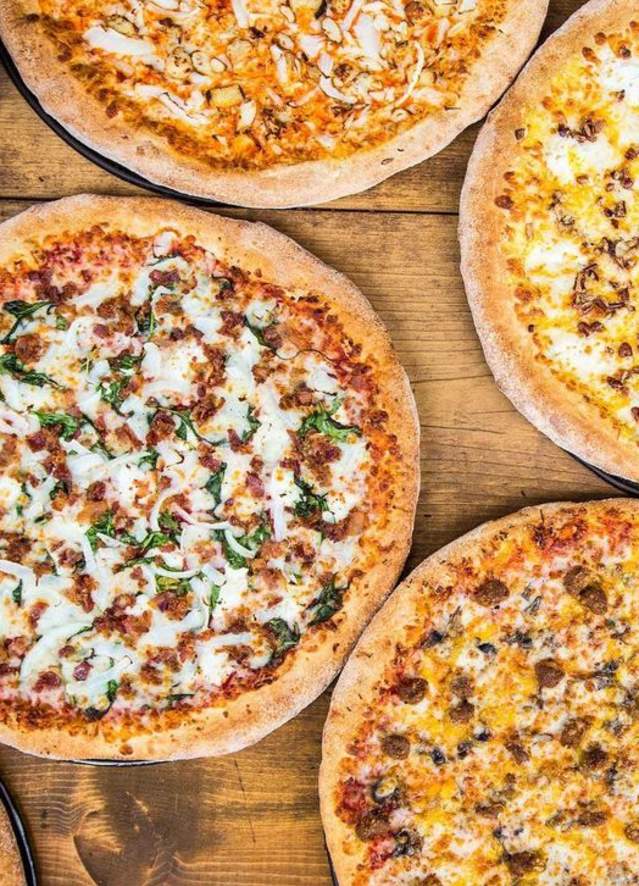 Spread of different pizzas from Pizza X
