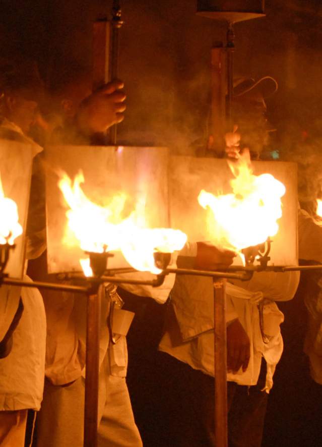 Flambeaux Lining Up at the Start of a Parade