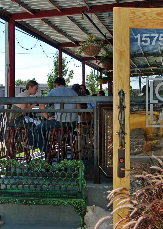 People dining on the outdoor patio at LoLa's in LoHi