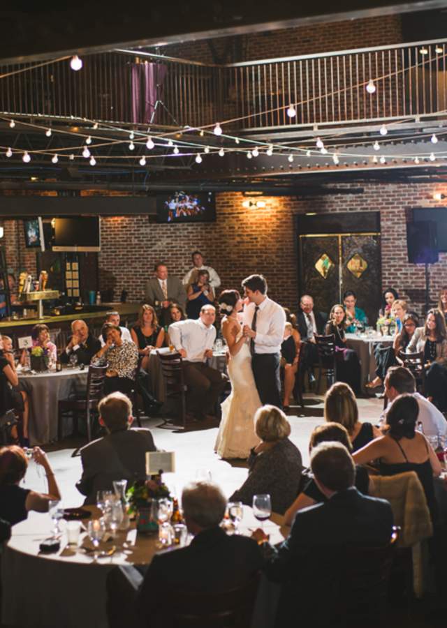 Newlyweds dancing at a wedding at Mile High Station in Denver, Colorado