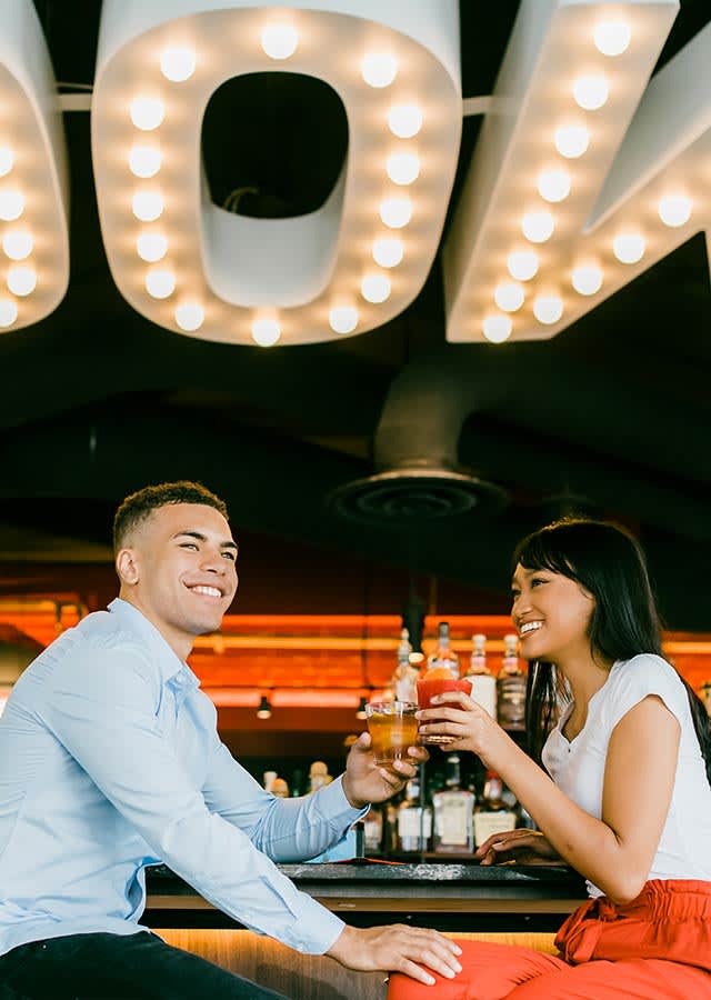 A couple having drinks at a restaurant.
