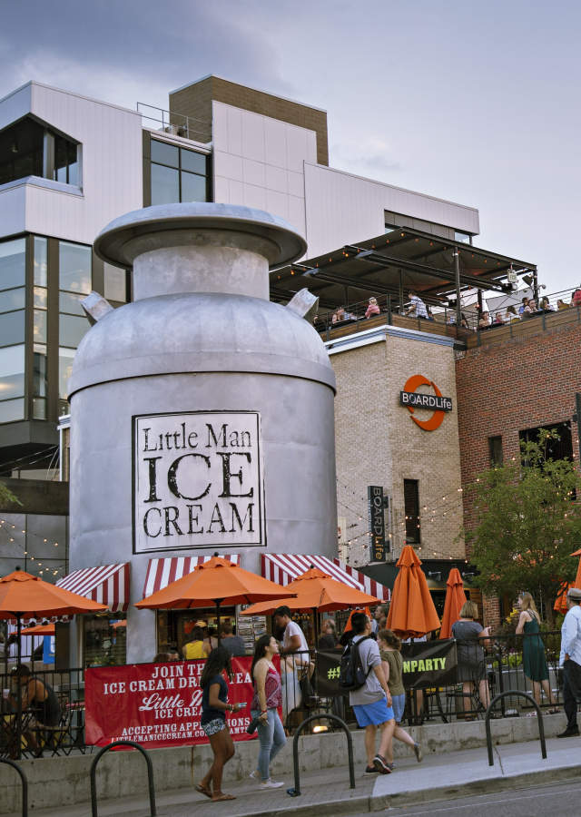 A large crowd gathers around Little Man Ice Cream in Denver, Colorado.
