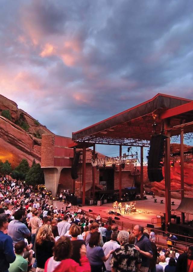 Concertgoers enjoying an evening of live entertainment at Red Rocks Park & Amphitheater