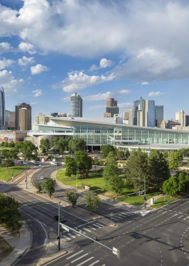 The Colorado Convention Center is with a rainbow above