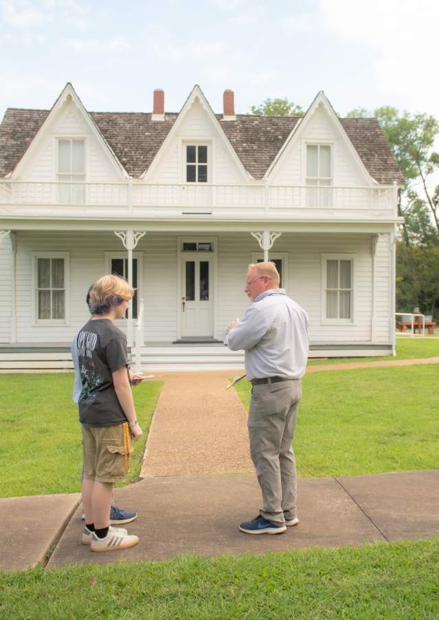 Visitors touring the Eisenhower Birthplace State Historic Site in Denison