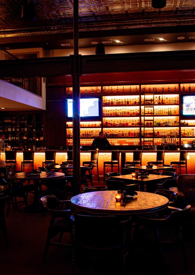 Interior view of Doc’s Lounge featuring seating, drinks, and live music atmosphere